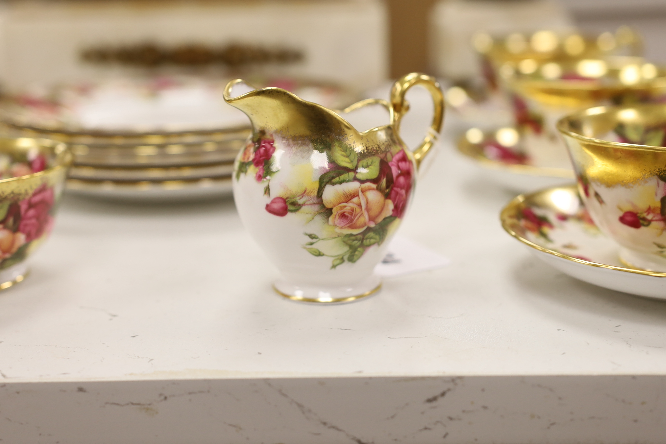 A Royal Chelsea ‘Golden Rose’ pattern part tea service